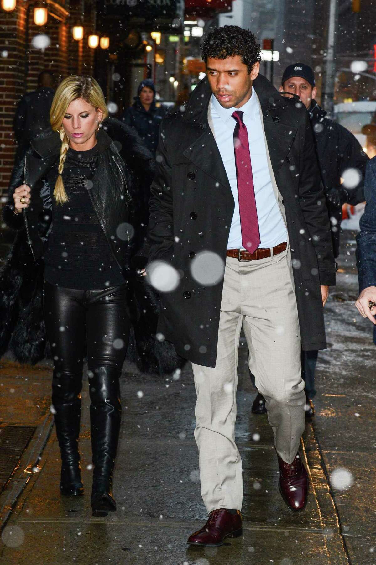 Russell Wilson and his wife, Ashton Meem, enter the "Late Show With David Letterman" taping at the Ed Sullivan Theater on February 3, 2014, in New York City -- the day after his Seahawks won Super Bowl XLVIII.