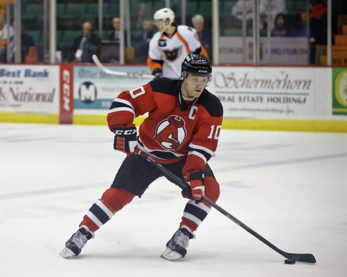 Albany Devil Rod Pelley handles the puck during a game Sunday afternoon on April 6, 2014, at the Glens Falls Civic Center. Photo By Eric Jenks