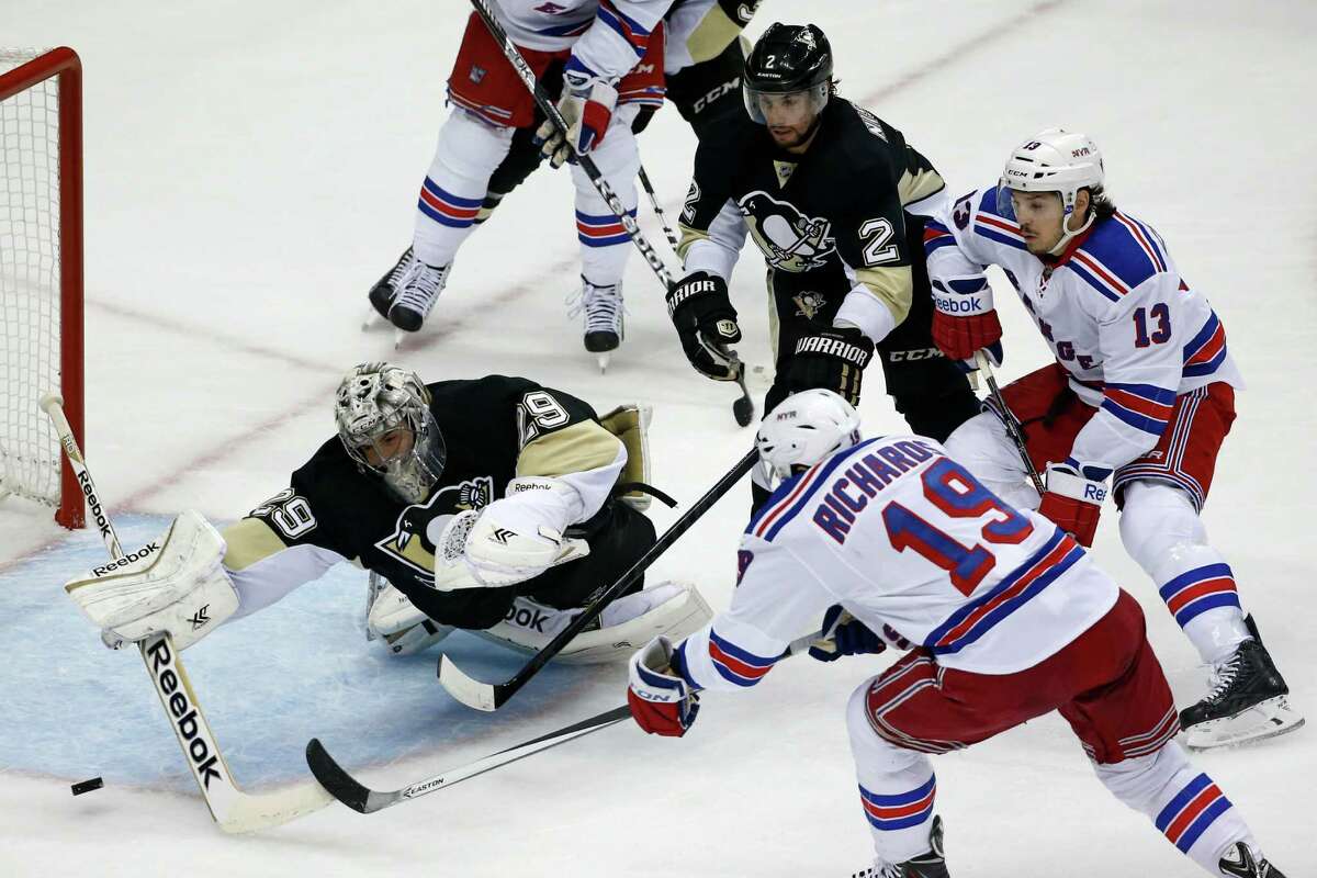 New York Rangers' Brad Richards (19) fires the puck past Pittsburgh Penguins goalie Marc-Andre Fleury (29) for a goal in the first period of Game 1 of a second-round NHL hockey playoff series in Pittsburgh, Friday, May 2, 2014. (AP Photo/Gene J. Puskar) ORG XMIT: PAGP101