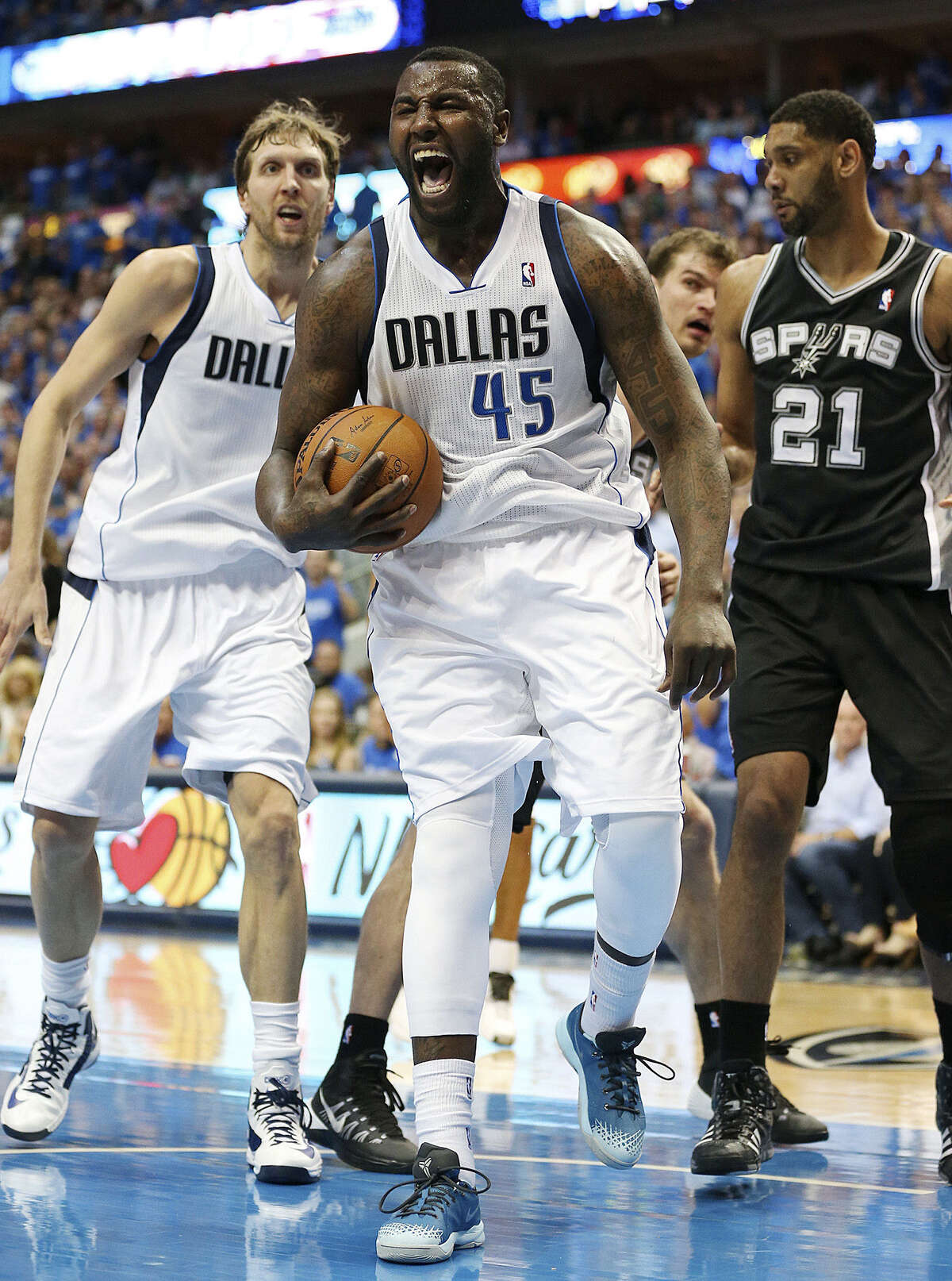 Ex-Spur DeJuan Blair (45) returned from a one-game suspension to score 10 points and grab a game-high 14 rebounds for Dallas. Dirk Nowitzki (left) finished with 22 points, while Tim Duncan had 16 points.