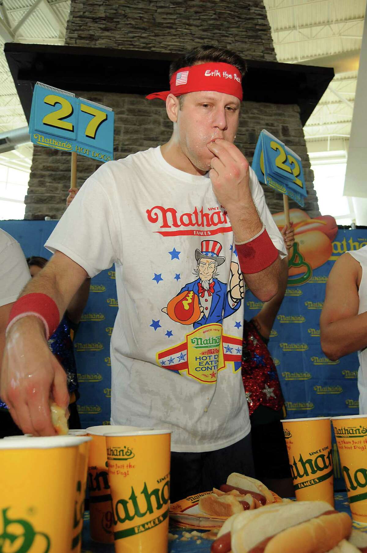 Men's favorite Erik "The Red" Denmark competes at the Nathan's Famous Hot Dog Eating Contest regional qualifier at Memorial City Mall Saturday May 03, 2014.(Dave Rossman photo)