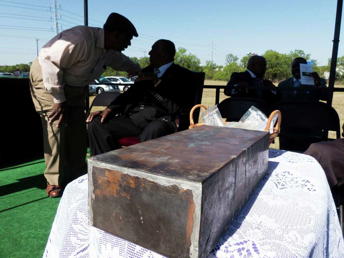 A time capsule recovered from the burned remains of the old Childress Memorial Church of God in Dignowity Hill sits by dignitaries before the groundbreaking ceremony at the church's new location on Binz-Engelman on Saturday, May 3, 2014. The capsule dates to 1908.
