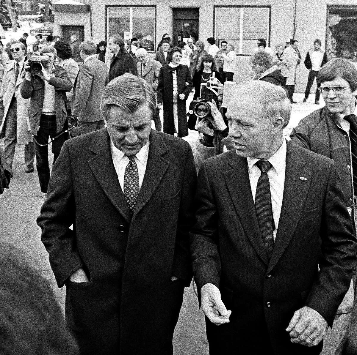 In 1983, Democratic presidential candidate Walter Mondale (left) leaves a food shelf store in Gilbert, Minn., with U.S. Rep. Jim Oberstar. Oberstar, who served northeastern Minnesota for 36 years, died Saturday at age 79.