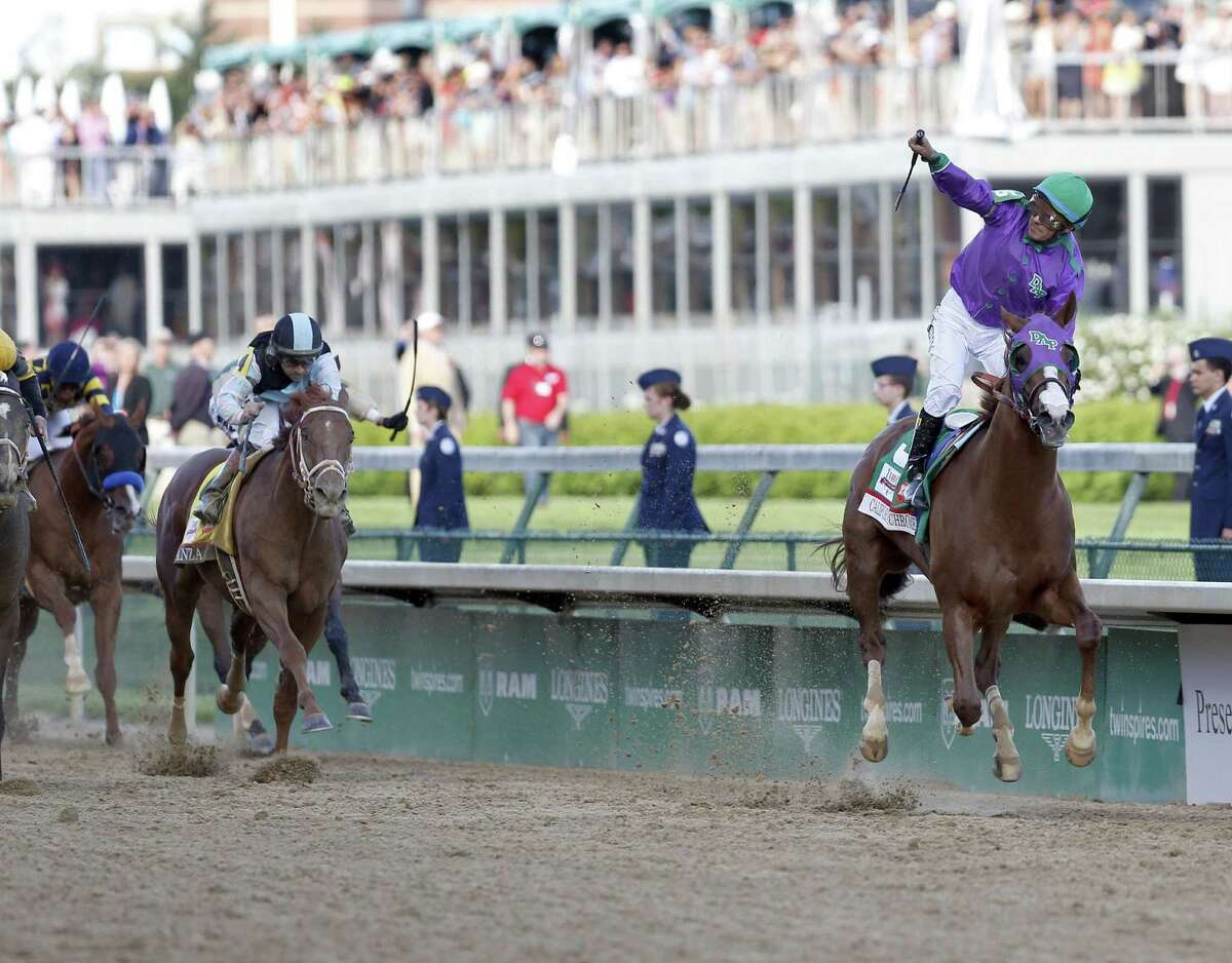California Chrome and jockey Victor Espinoza cruise home down the stretch to win the 140th Kentucky Derby at Churchill Downs. The colt paid $7, $5.60 and $4.20.