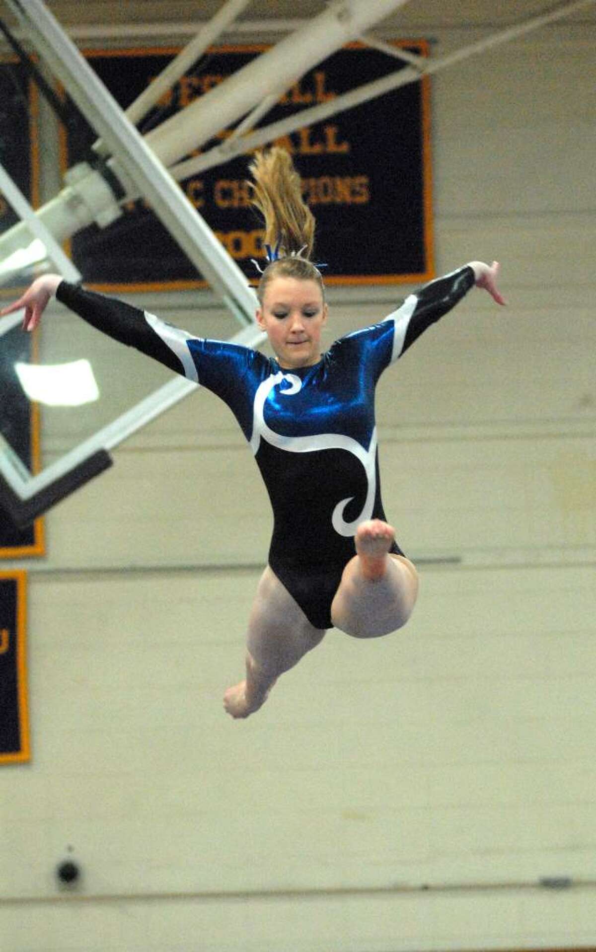 Charlotte Morgan from Darien High School competes at the FCIAC Gymnastics Championships at Westhill High School on Friday February 12, 2010.