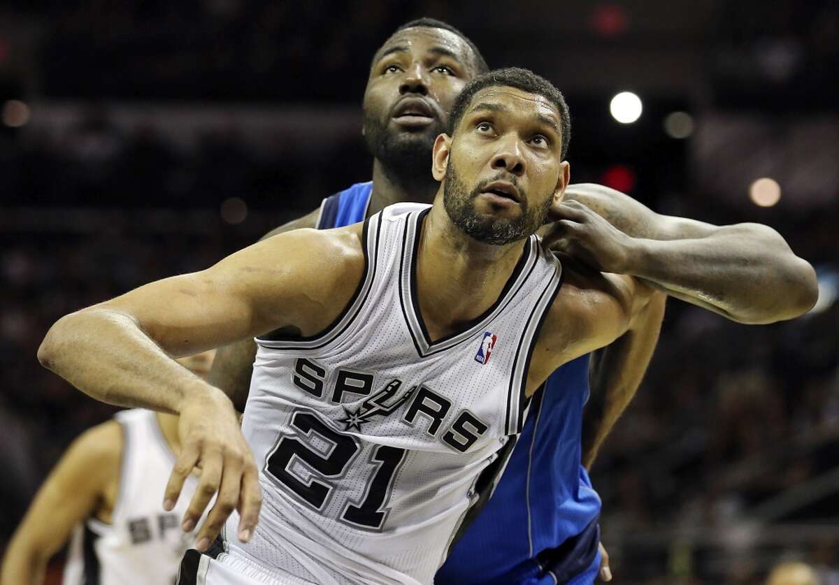 San Antonio Spurs' Tim Duncan and Dallas Mavericks' DeJuan Blair struggle for position during first half action of Game 7 in the first round of the Western Conference playoffs Sunday May 4, 2014 at the AT&T Center.