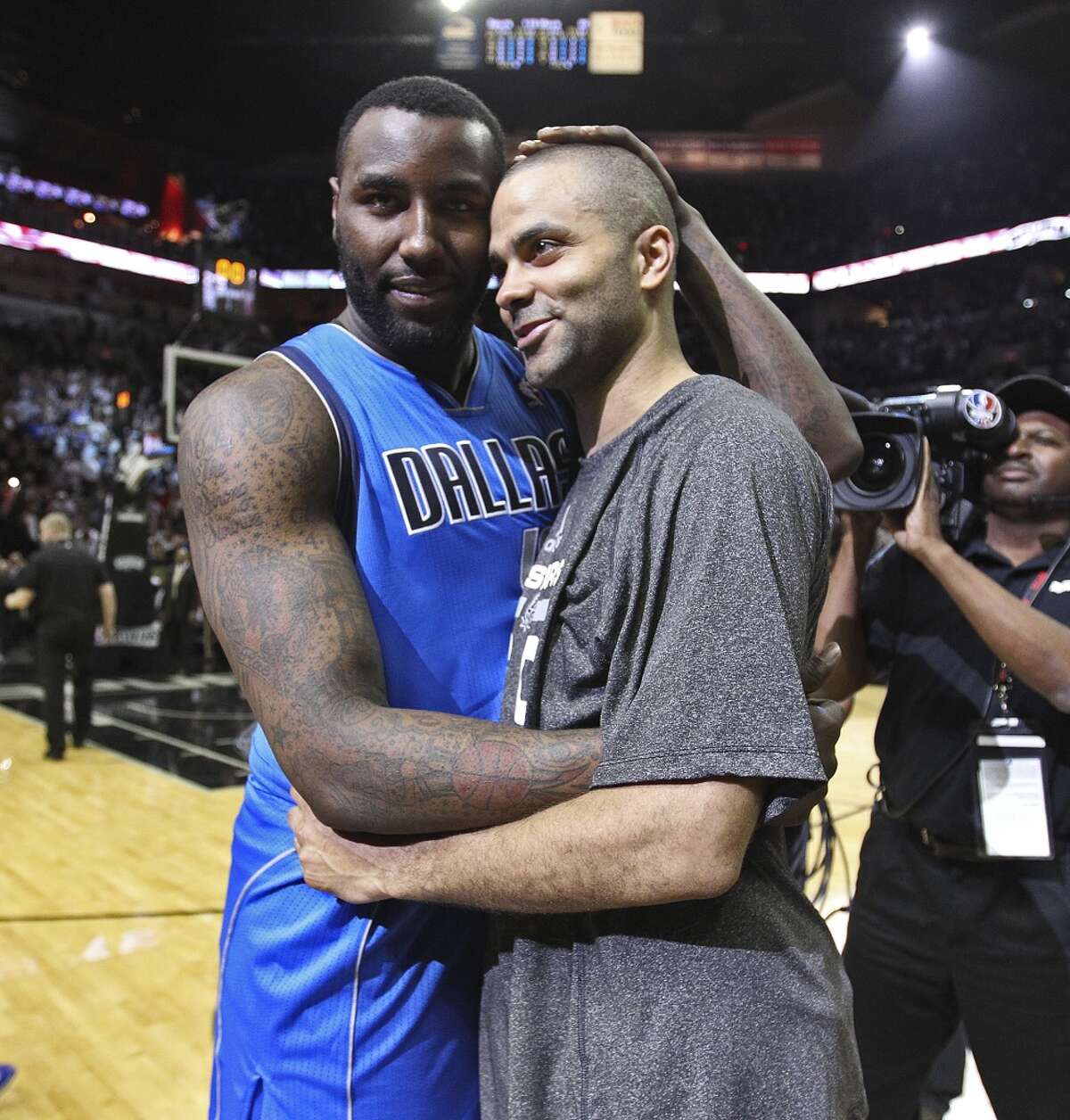 San Antonio Spurs' Tony Parker hugs Dallas Mavericks' DeJuan Blair at the end of game seven in the first round of the Western Conference Playoffs at the AT&T Center, Sunday, May 4, 2014. The Spurs won, 119-96 to move on to the conference semi-finals against the Portland Trailblazers.