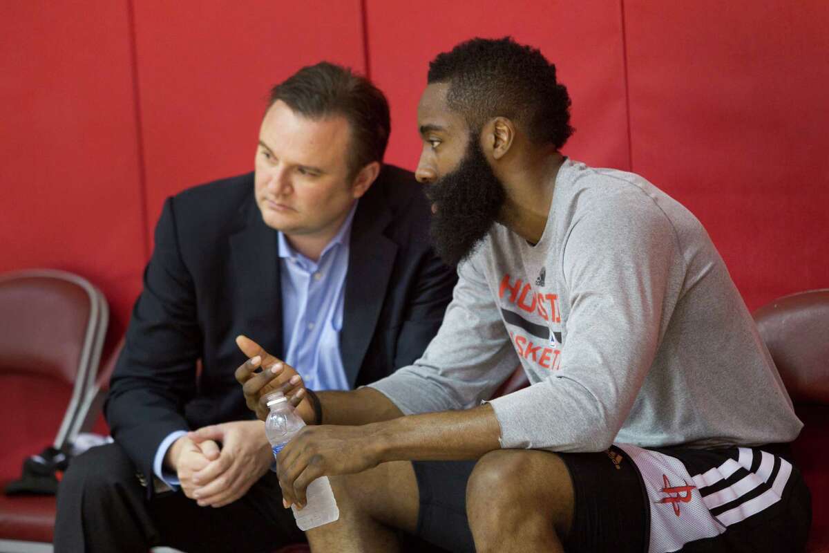 Rockets general manager Daryl Morey, left, talking with James Harden at a 2014 practice.