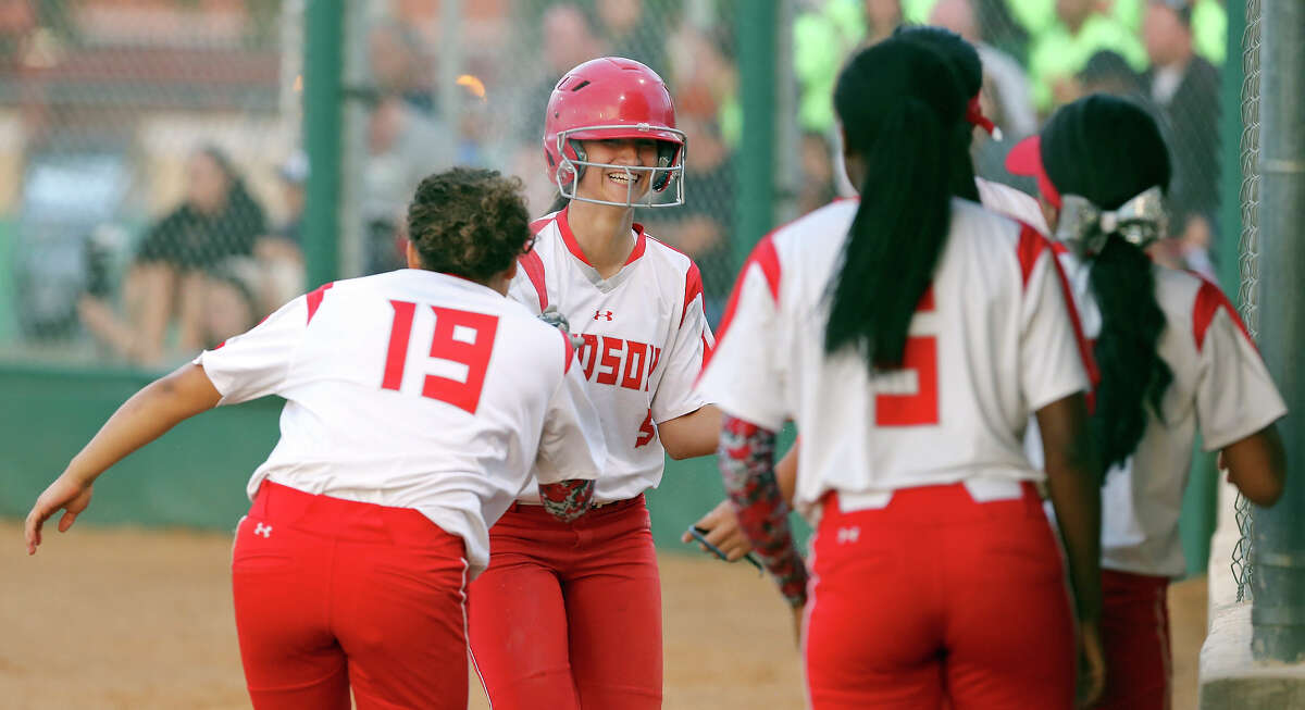 Judson's Arianna Ricondo (center) celebrates with teammates after scoring in the third inning against Southwest during their Class 5A second round playoff game at NEISD Complex. Judson won 8-4.