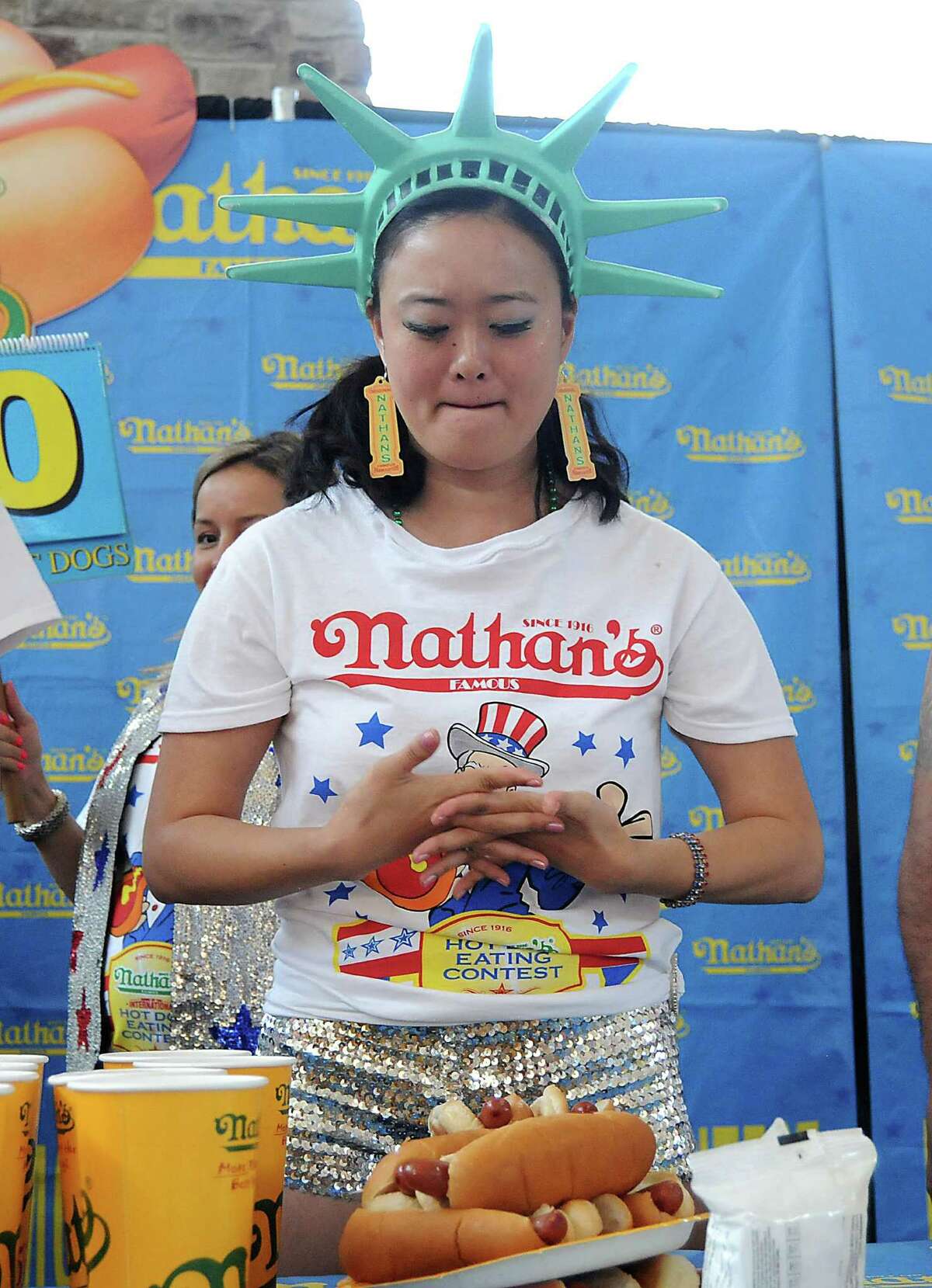 Mary Bowers takes a deep breath before the start of Saturday's hot-dog-eating contest at Memorial City Mall.