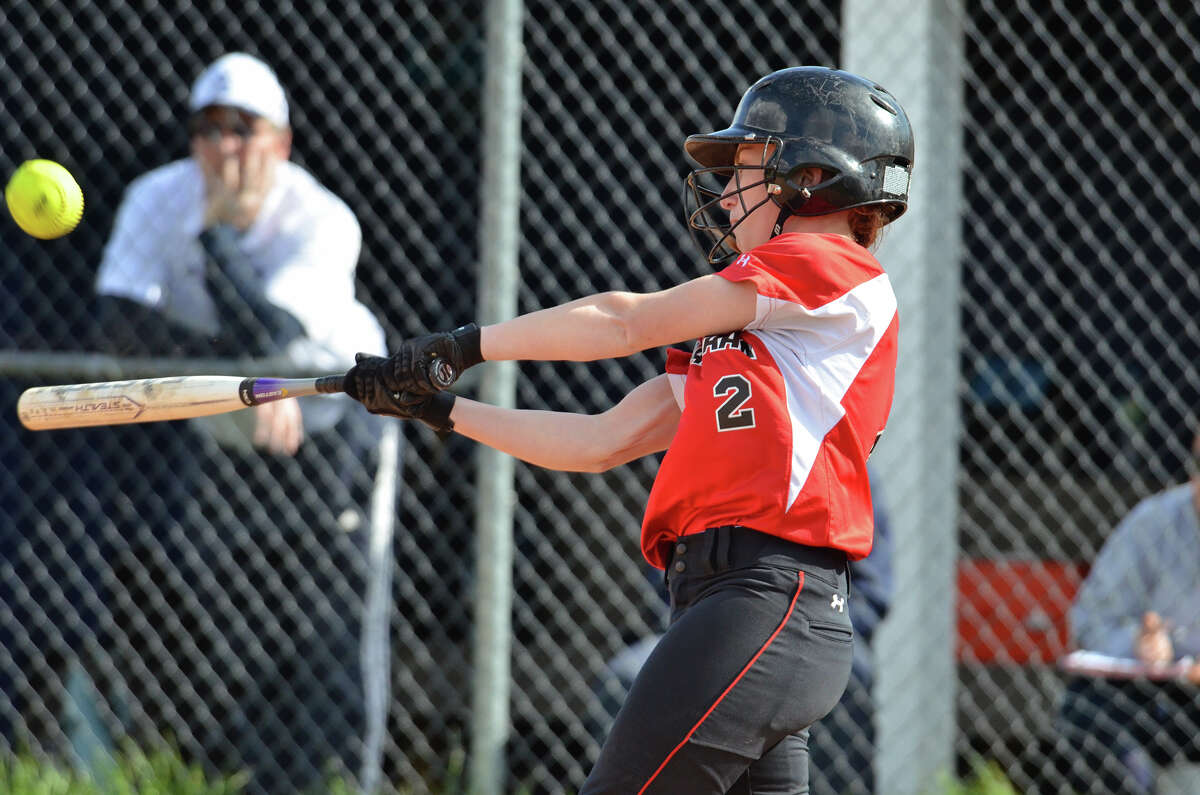 New Canaan's Molly Keshin connects with the ball during the softball game against Staples High School in Westport on Tuesday, May 6, 2014.