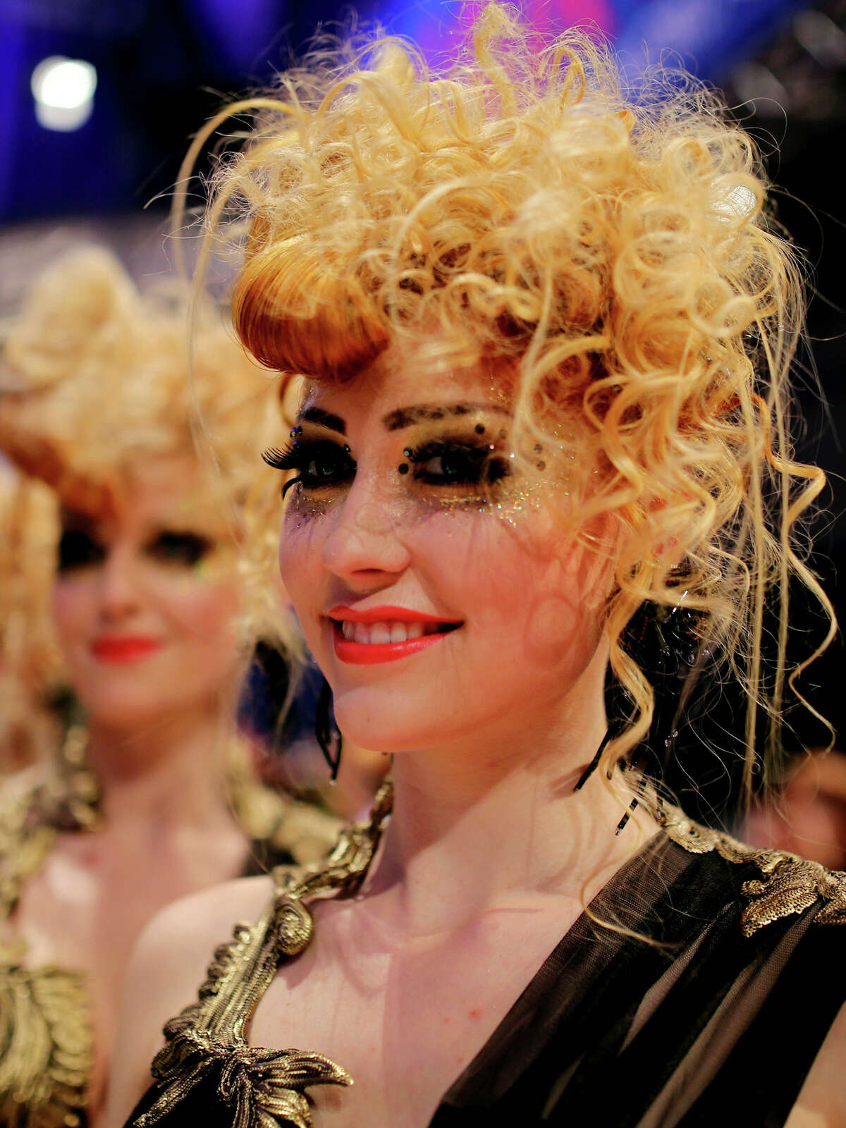 Models walk on the podium during the OMC Hairworld World Cup contest on May 5, 2014 in Frankfurt am Main, Germany.