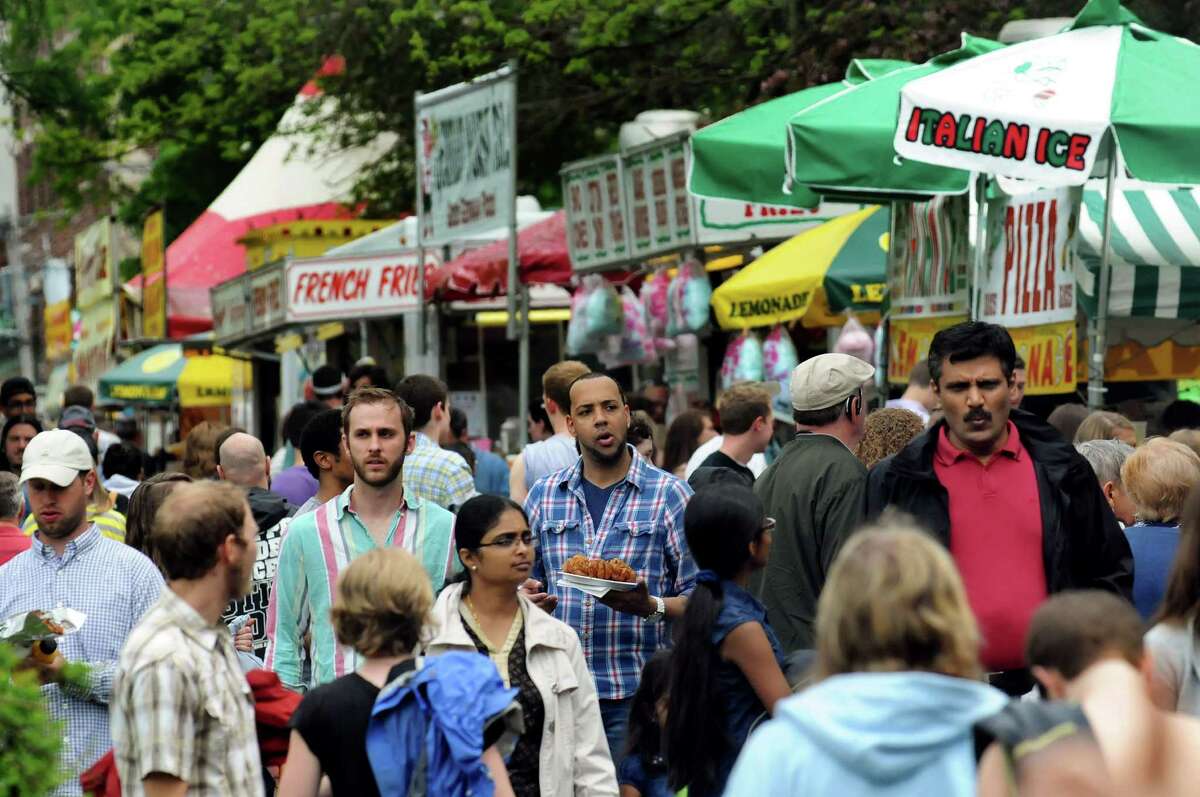 Festival goers cruise through the food alley during the Tulip Festival on Saturday, May 11, 2013, at Washington Park in Albany, N.Y. (Cindy Schultz / Times Union)
