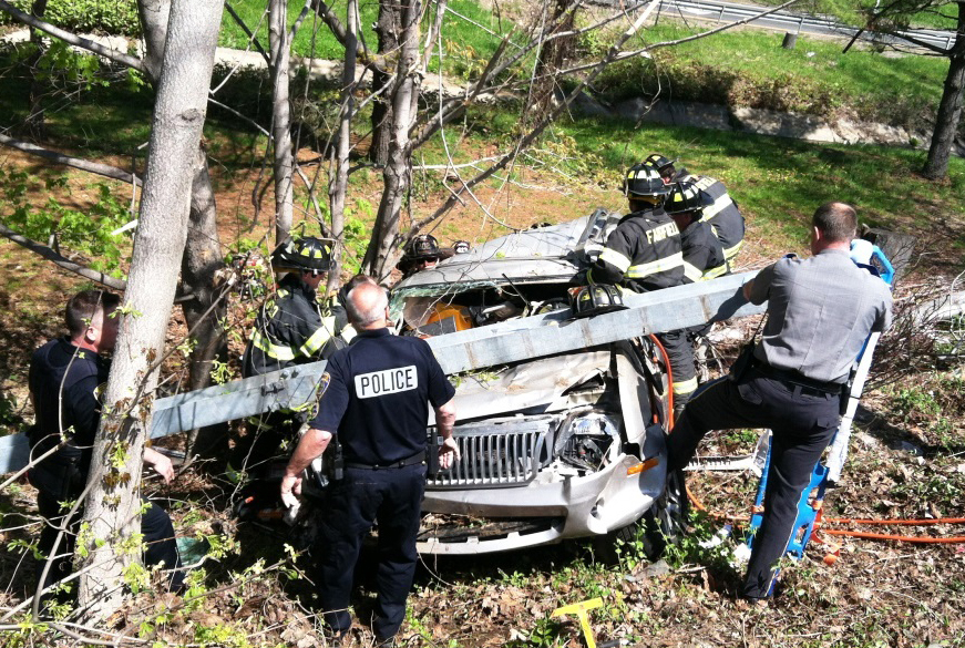 Driver extricated from SUV after rolling down I-95 embankment