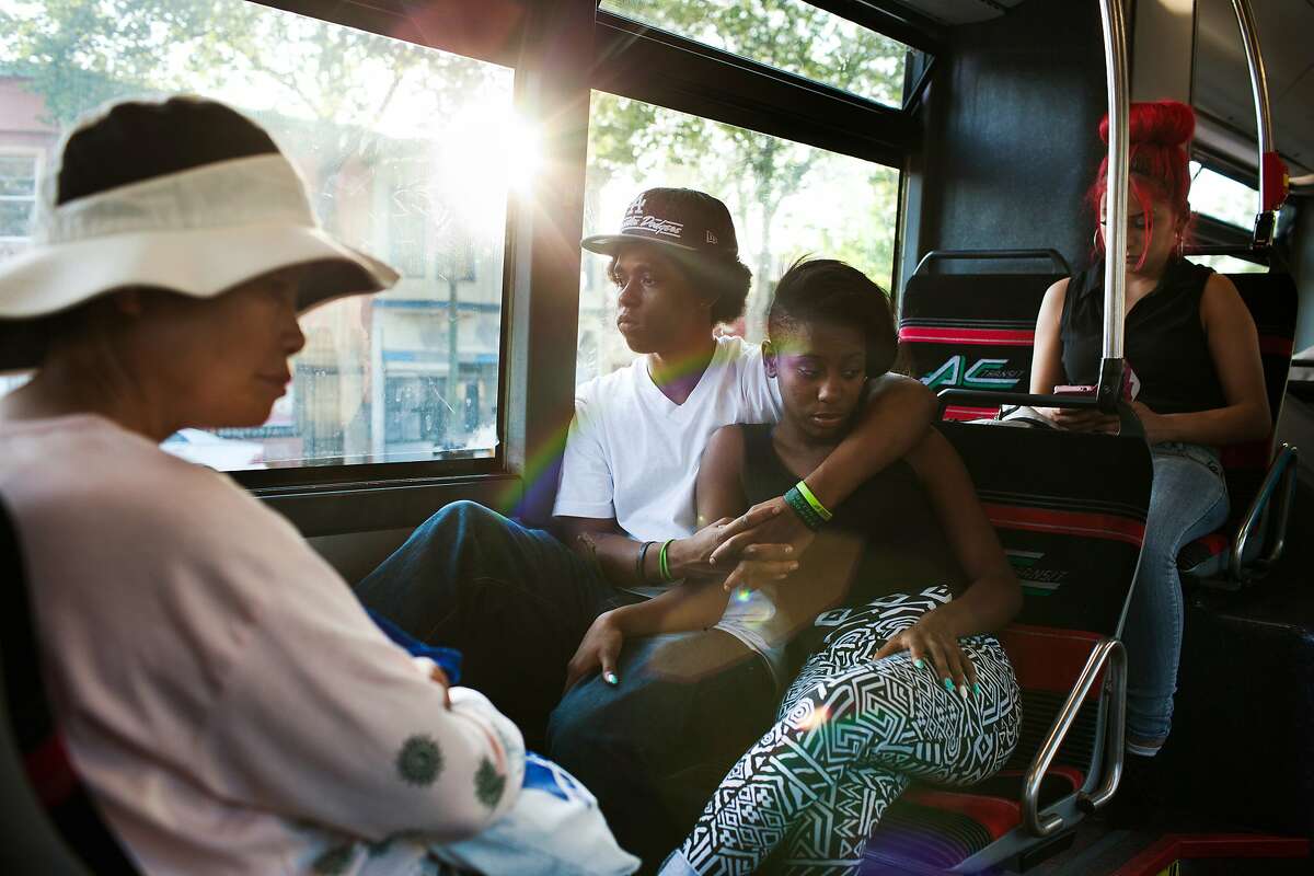 Javontae Roberts, 18, center left, and Lyric Stafford, 17, center right, ride the AC Transit 1R bus line toward Oakland, Calif. on Thursday, May 1, 2014. The 1R, which stands for rapid, is the predecessor to the bus rapid transit system that is slated to be built along International Boulevard. The BRT system will run more like a subway and will have dedicated lanes or stations. The new system has stalled due to public resistance to taking away a lane or two of traffic and eliminating parking.