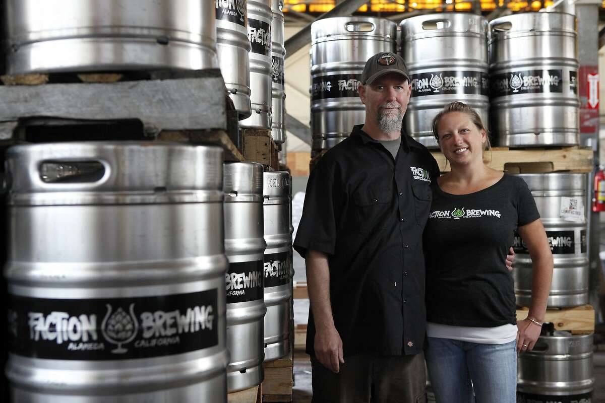 Husband and wife team and owners, Rodger Davis and Claudia Pamparana pose for a portrait at Faction Brewing Company in Alameda, CA, Wednesday May 7, 2014.