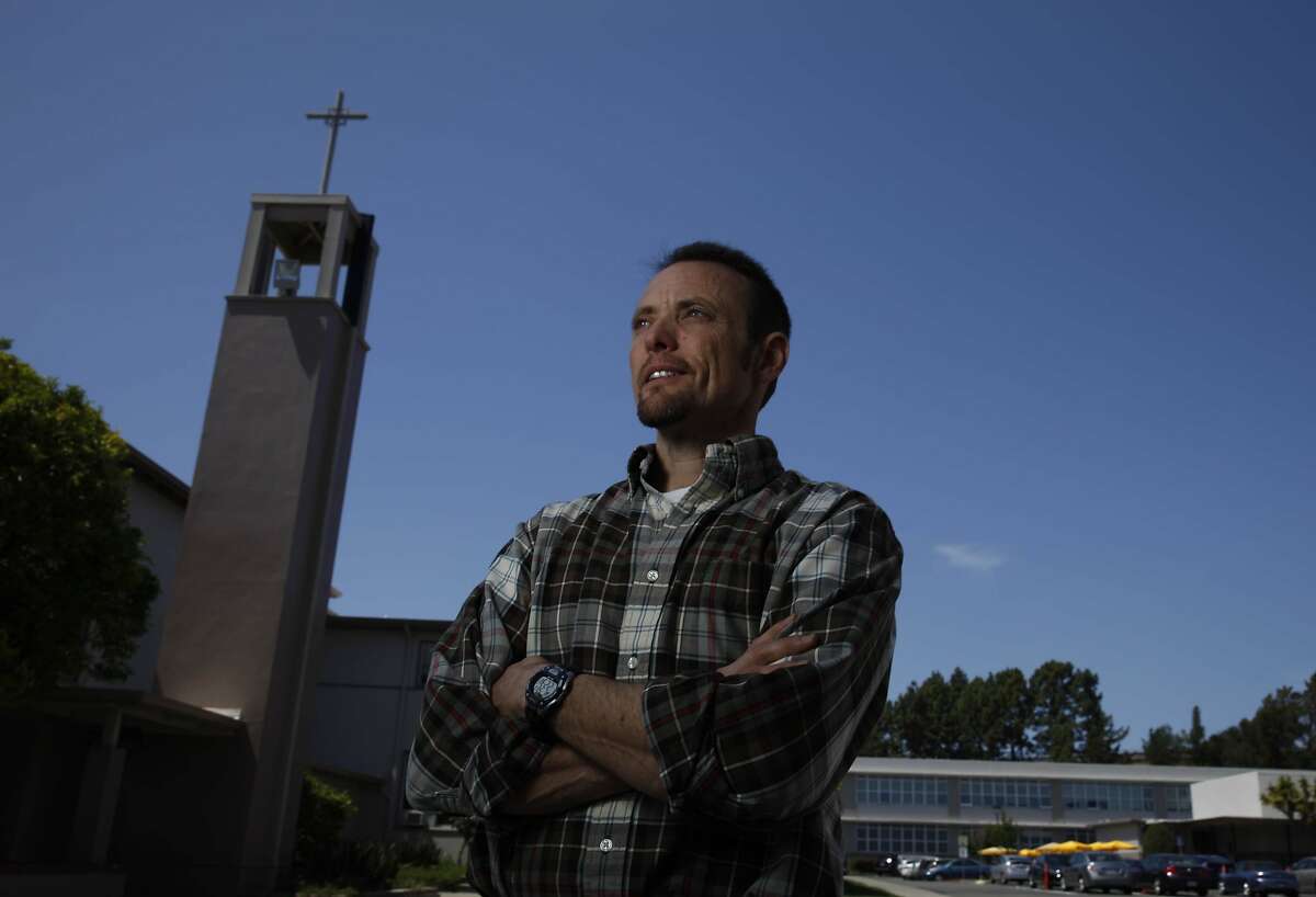 Tim Newman, Bishop O'Dowd High School science department chair, stands near a chapel on campus at Bishop O'Dowd High School on Wednesday, May 7, 2014 in Oakland, Calif.