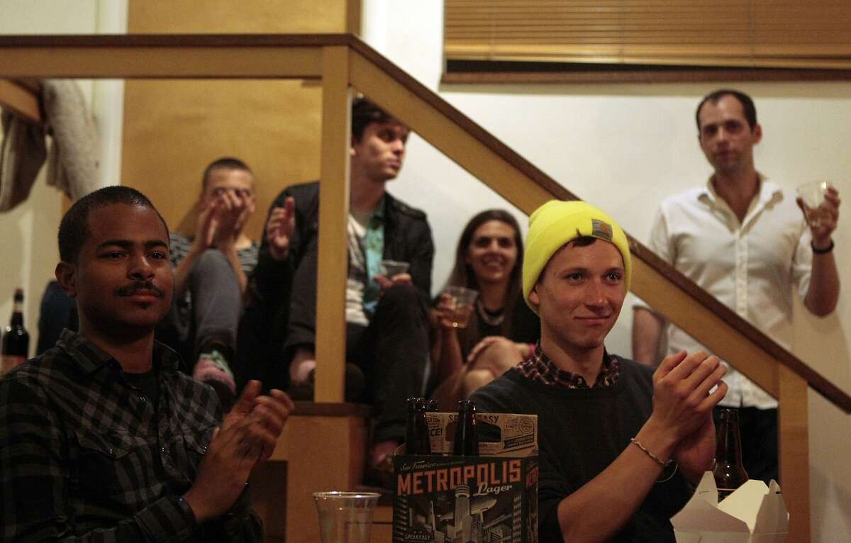 Ethan Avey (right) claps during a classical concert by One Found Sound Quintet put on by Groupmuse on April 18, 2014 in Emeryville, Calif. Groupmuse hosts free classical concerts in private homes making the genre more accessible to different groups.