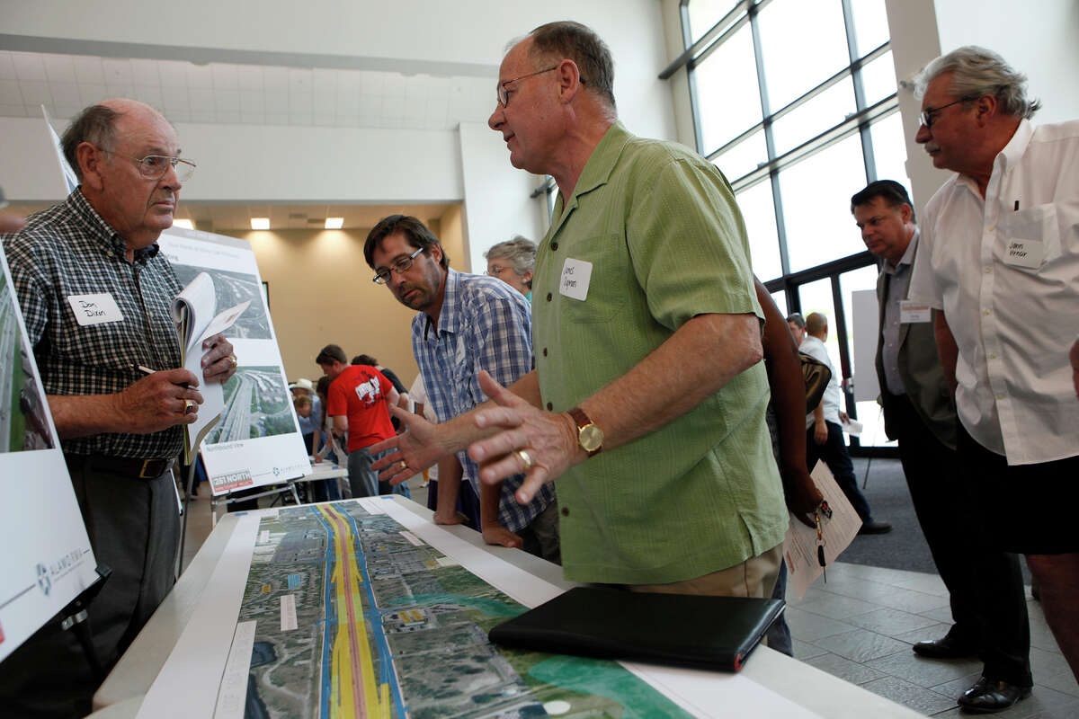 Don Dixon (left) and James Sigmon have a discussion Thursday May 8, 2014 during the the Alamo Regional Mobility Authority open house for the 281 North Improvement Project which would include managed lanes, or toll lanes on U.S. 281. There were three sections of U.S. 281 that were out for the public to view and ask questions on as well as two televisions with the visualizations of the "preferred alternative" on 281. Dixon believes that the city and state are mistreating their taxpayers with this plan and that this would be a double tax .