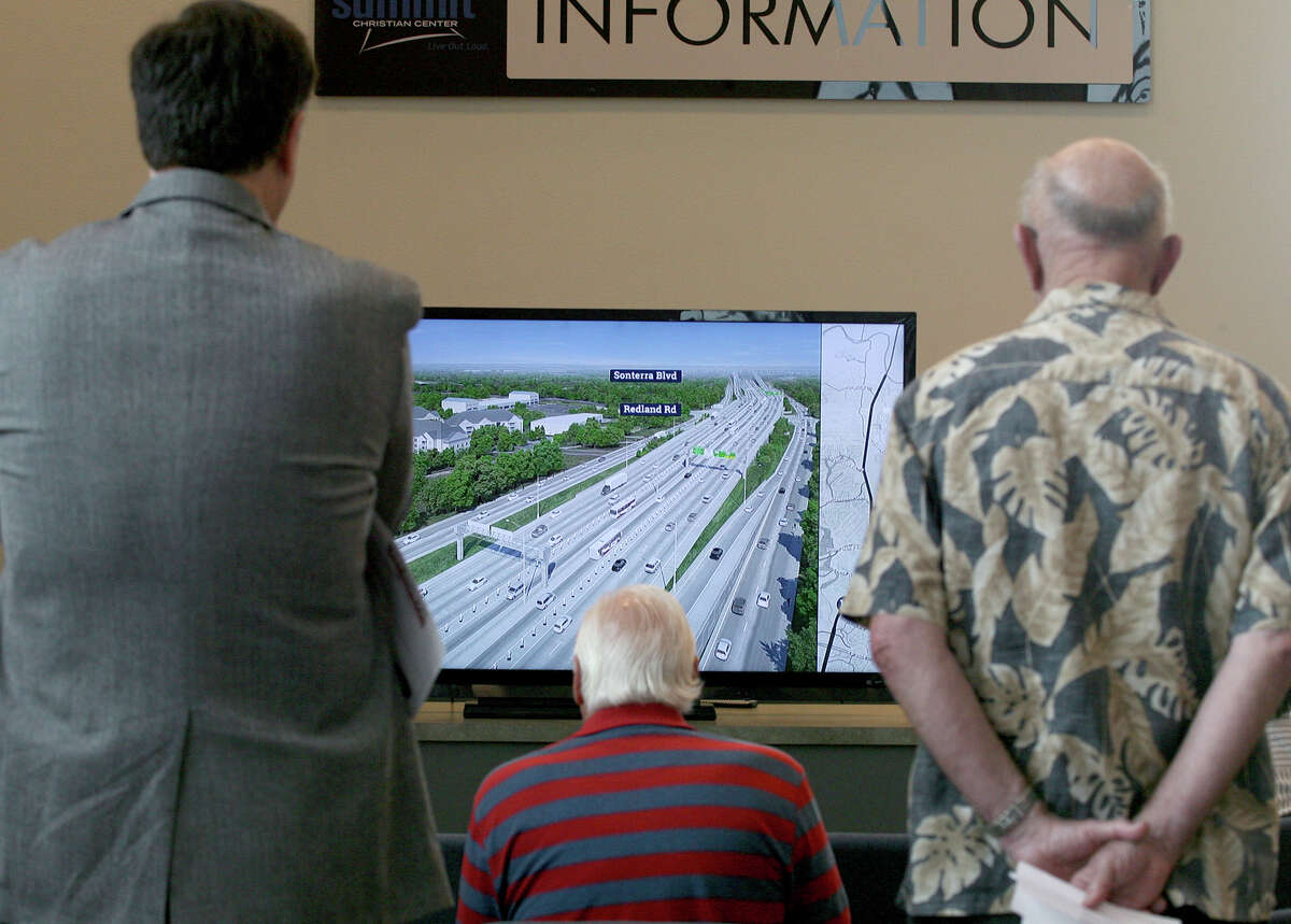 People watch one of two televisions with the visualizations of the "preferred alternative" of U.S. 281 during The Alamo Regional Mobility Authority open house Thursday May 8, 2014 for the 281 North Improvement Project which would include managed lanes, or toll lanes on U.S. 281. There were three sections of U.S. 281 that were out for the public to view and ask questions on. The visualizations will be on the www.411on281.com website tomorrow.