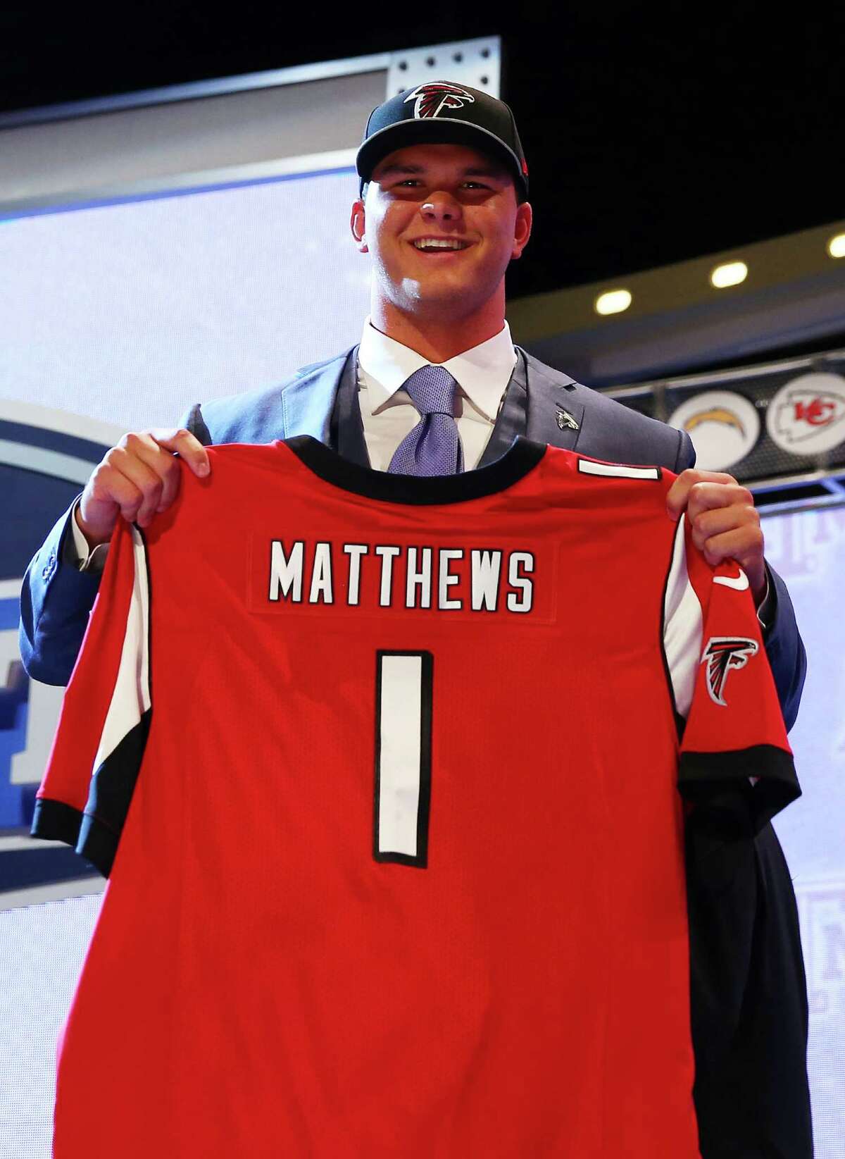 NEW YORK, NY - MAY 08: Jake Matthews of the Texas A&M Aggies poses with a jersey after he was picked #6 overall by the Atlanta Falcons during the first round of the 2014 NFL Draft at Radio City Music Hall on May 8, 2014 in New York City.