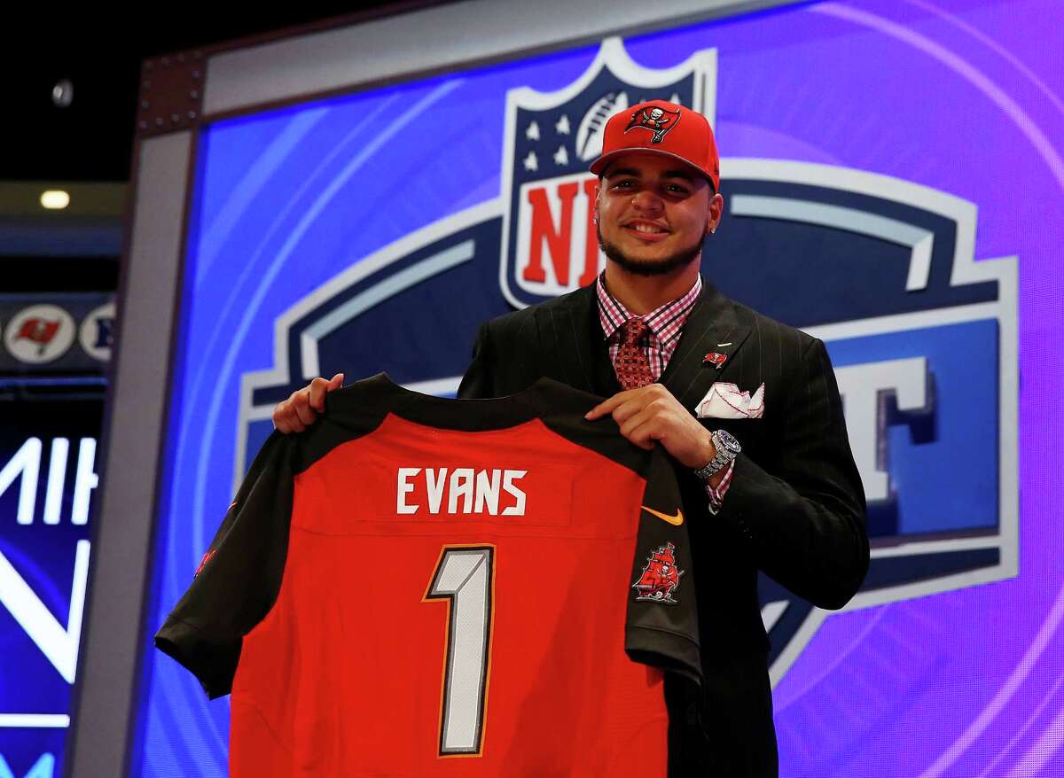 NEW YORK, NY - MAY 08: Mike Evans of the Texas A&M Aggies poses with a jersey after he was picked #7 overall by the Tampa Bay Buccaneers during the first round of the 2014 NFL Draft at Radio City Music Hall on May 8, 2014 in New York City.