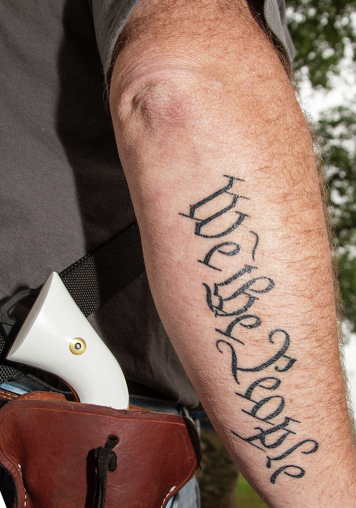 Tattoo found on an arm at an Open Carry Texas rally in support of Henry Vichique, Sunday, April 6, 2014, at the San Antonio Police Department West Substation. 19 year-old Vichique was tased and arrested on March 31, 2014 while walking home with a loaded rifle.