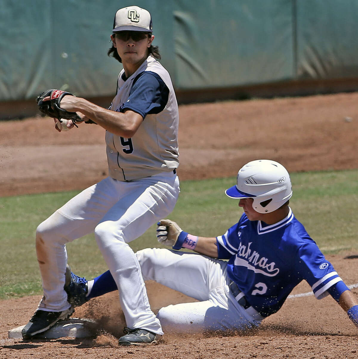 O'Connor's Dillon Stumpf forces out MacArthur's Bobby Lepovitz at third base to help end a late-inning rally attempt.