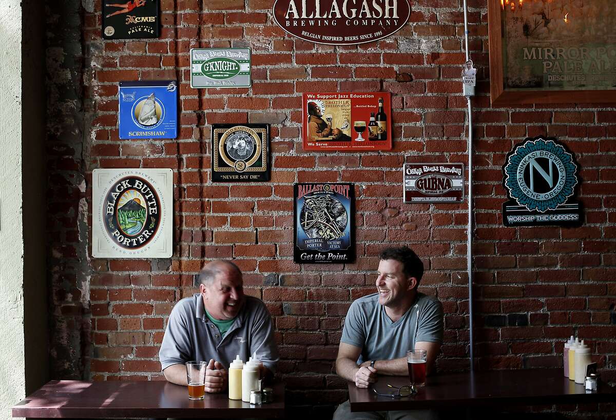 JD Stager, right, and Dave Dorman have a beer at the Original Gravity Public House in San Jose, Calif., on Friday, May 2, 2014.