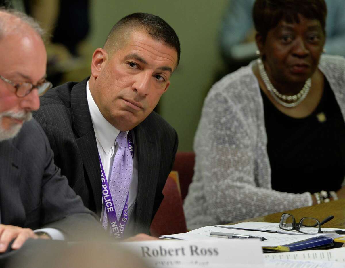 New York State Police Superintendent Joseph D'Amico, center, listens during a New York State Assembly roundtable discussions on an opiate and heroin use crises within the state Monday morning, May 12, 2014, at the Legislative Office Building in Albany, N.Y. (Skip Dickstein / Times Union)