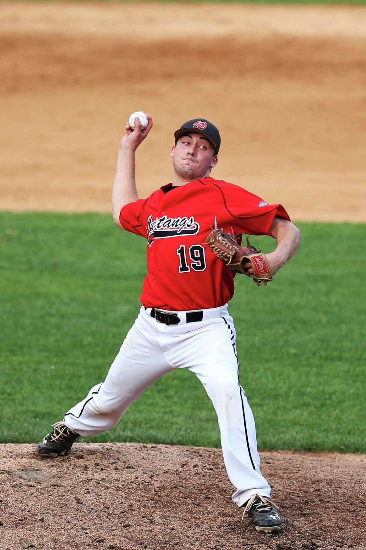 Fairfield Warde's pitcher #19 Nick Nardone delivers the pitch during Monday evenings match-up against Fairfield Ludlowe at Harbor Yard in Bridgeport.