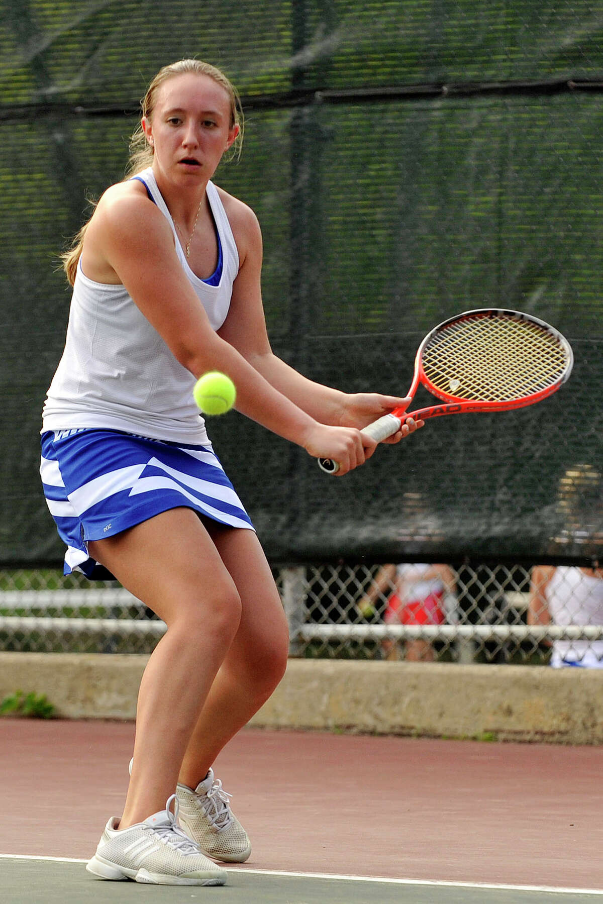 Fairfield Ludlowe's Lindsey Evans returns the ball to Greenwich's Anna Daccache during their tennis match at Greenwich High School in Greenwich, Conn., on Monday, May 12, 2014.