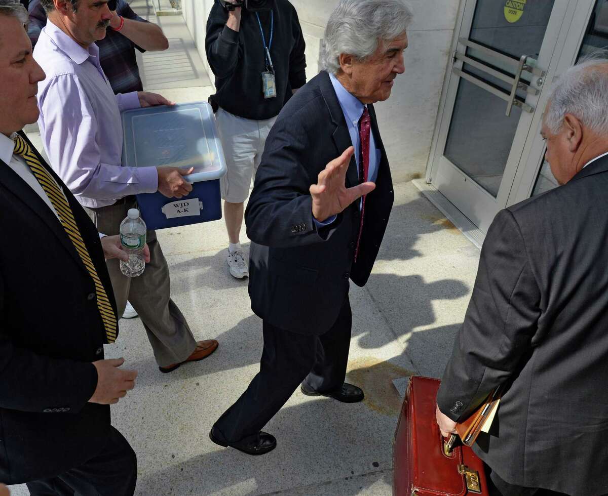 Former Senate Majority Leader Joseph Bruno, right, waves as he enters James T. Foley U.S. Courthouse Monday morning, May 12, 2014, with his attorney Bill Dreyer, right, for the continuation of Bruno's corruption trial in Albany, N.Y. (Skip Dickstein / Times Union)
