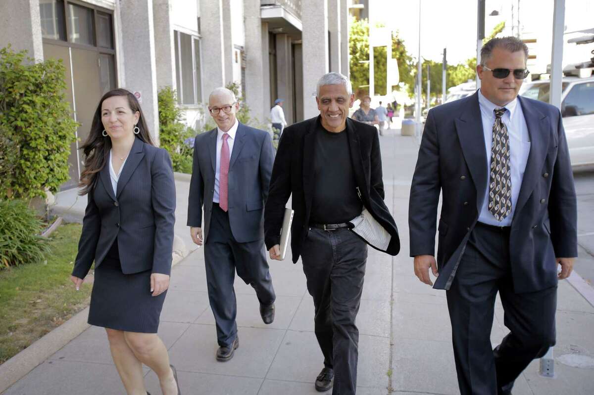 Silicon Valley billionaire Vinod Khosla (center) and his attorneys exit the San Mateo County Superior Court building in Redwood City in May.