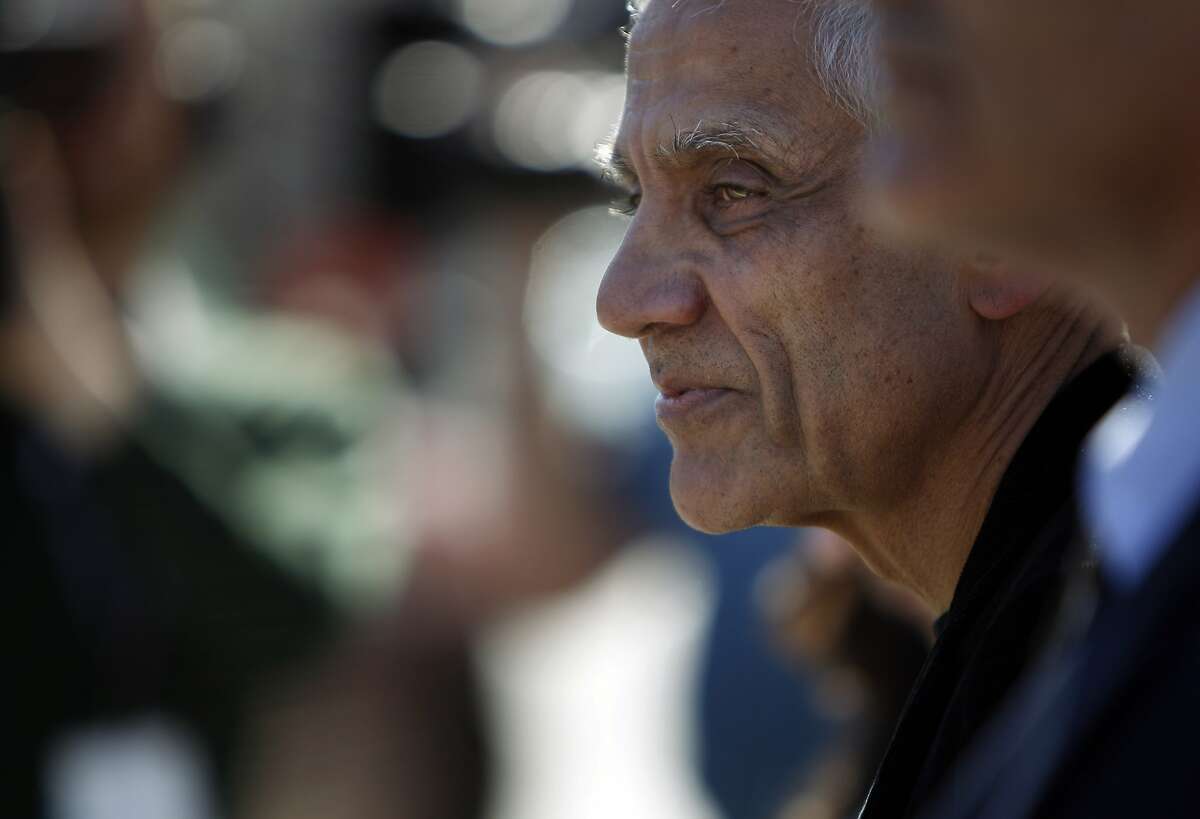 Silicon Valley billionaire Vinod Khosla departs from the San Mateo County Superior Court building with his attorneys in Redwood City, Calif., on Monday, May 12, 2014, after testifying in the Martin's Beach lawsuit.