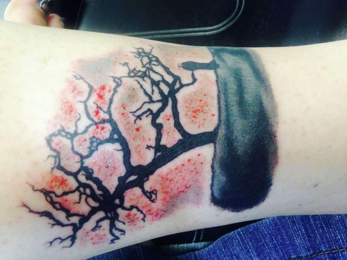 Jammie Leigh: This is an album artwork from The Smashing Pumpkins Adore album. It is a cover-up of my stupid ex husband's name. Replacing something ugly with something beautiful. It's brand new! Done by artist Ryan Green @ All About Art, Lumberton, Tx.