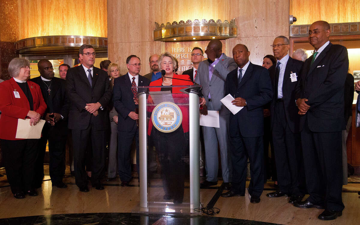 Mayor Annise Parker and supporters of her proposed nondiscrimination ordinance announce a compromise during a news conference at City Hall, Tuesday, May 13, 2014, in Houston. The proposed change in the Houston Equal Rights Ordinance would specify that no business open to the public could deny a transgender person entry to the restroom consistent with his or her gender identity.