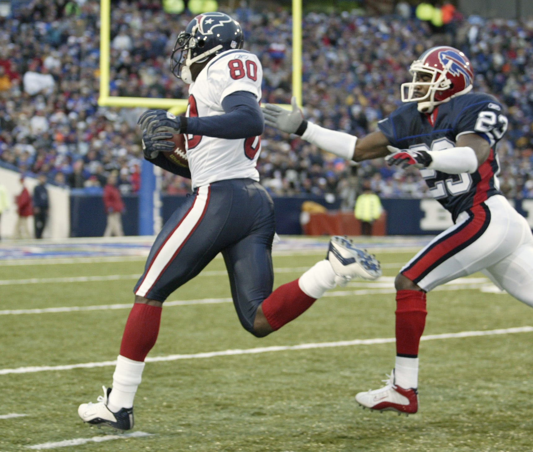 Seattle Seahawks' Ken Lucas (21) tackles Tampa Bay Buccaneers' wide  receiver Tim Brown during Sunday's game against the Seattle Seahawks at  Raymond James Stadium on Sept. 19, 2004 in Tampa, FL. The