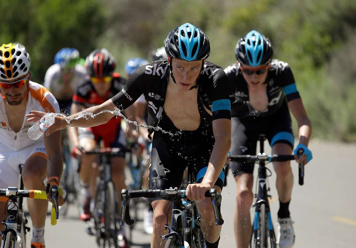British rider Josh Edmondson of Team Sky tosses away a water bottle during the hot climb up Mount Diablo in Stage 3.