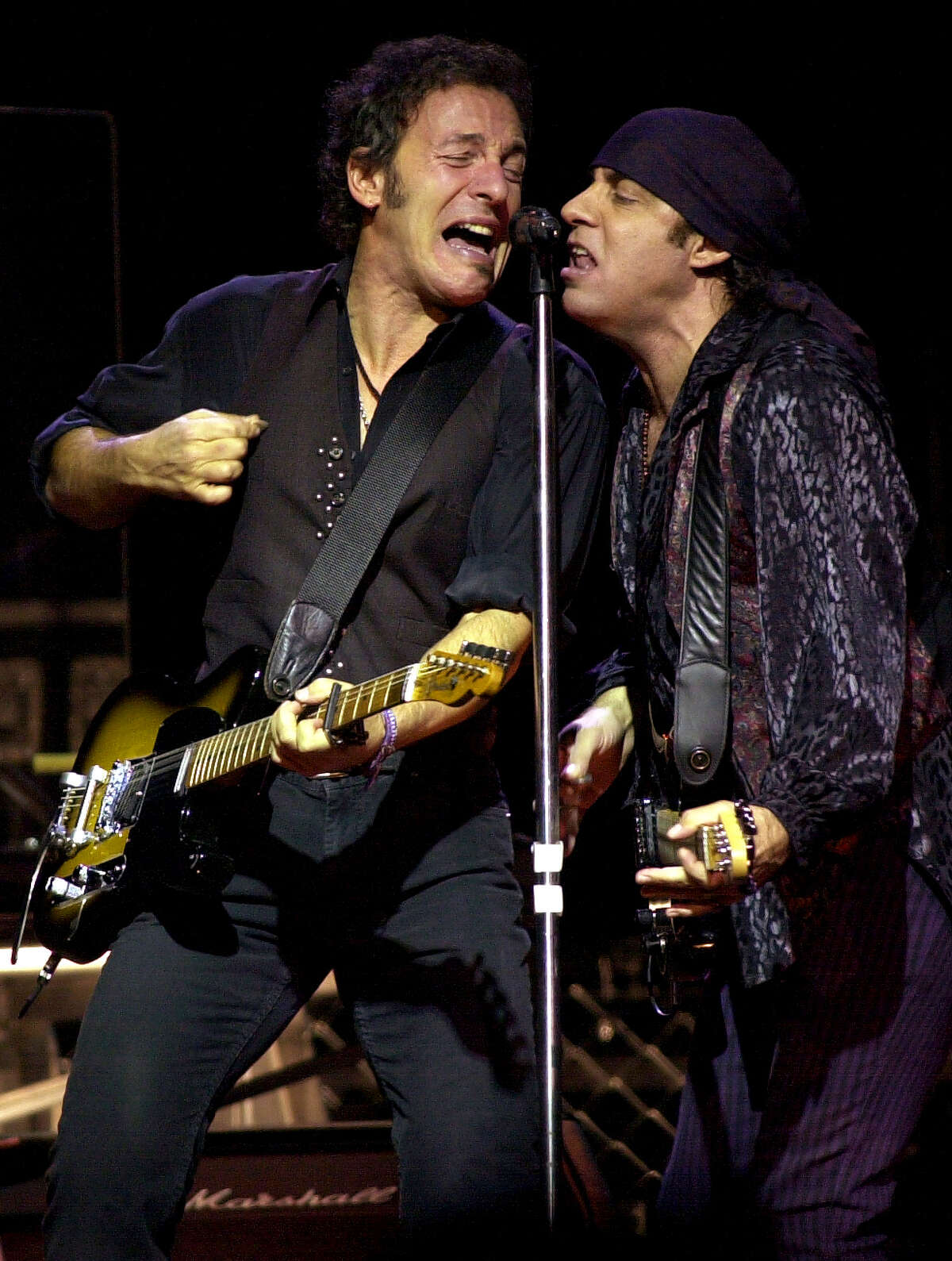 Times Union staff photo by Lori Kane Bruce Springsteen and Steven Van Zandt sing to a sold out crowd at the Pepsi Arena on Friday, December 13, 2002. Springsteen had his E Street band with him.