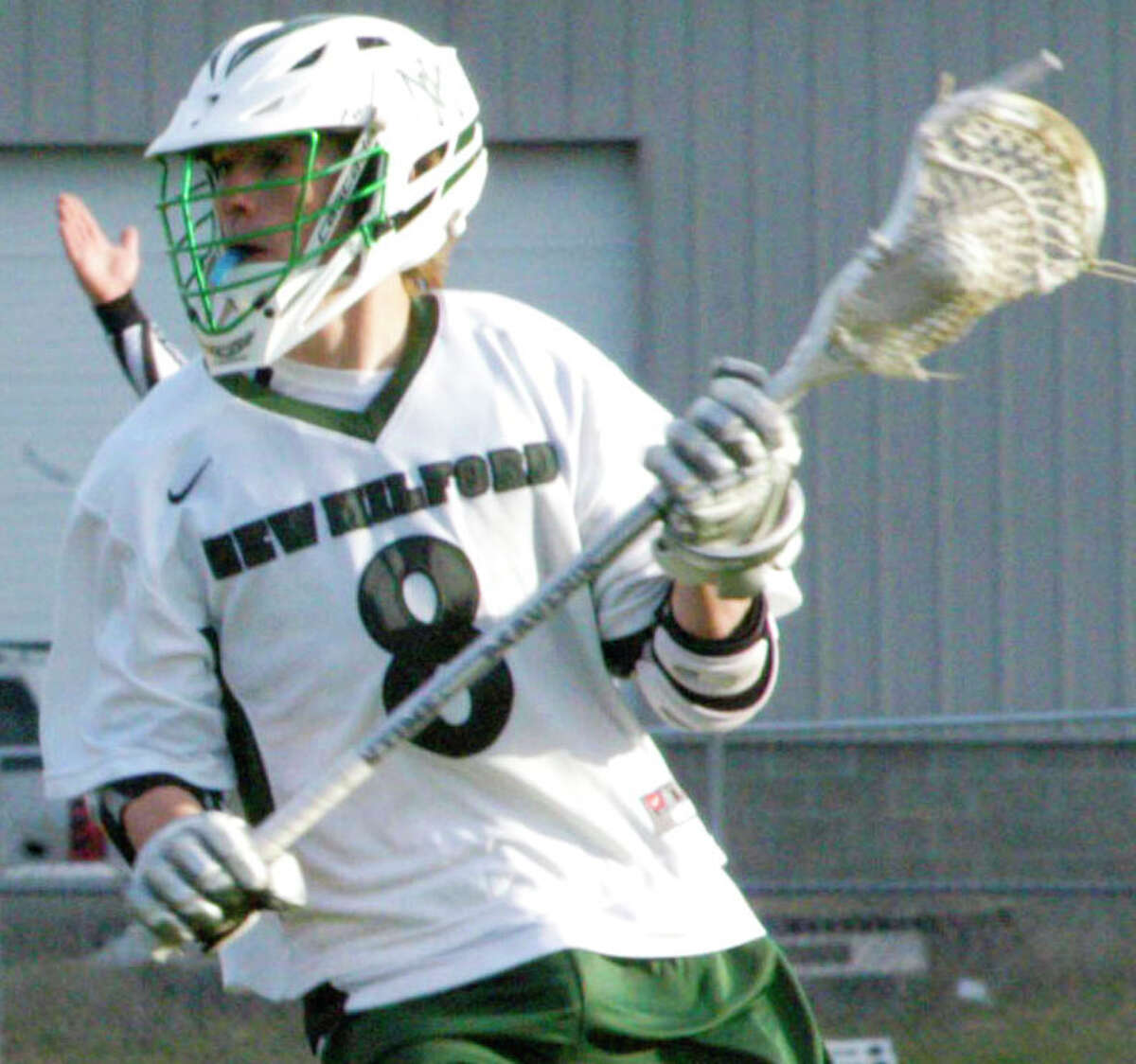 Blaine McMahon, shown here during New Milford High School boys' lacrosse's 11-6 victory over Weston, April 28,2014 at NMHS, and his Grreen Wave teammates have set their sights high this spring.