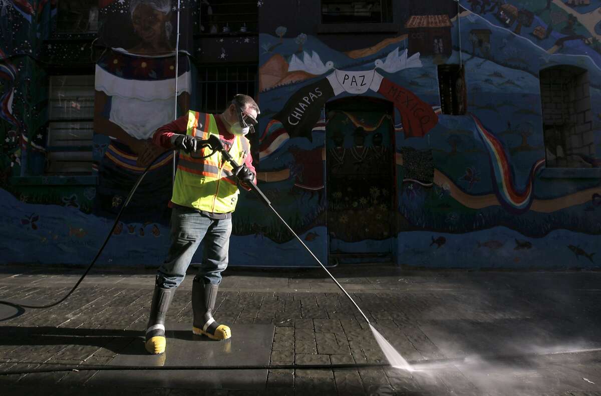 Steve Mahoney uses a power washer to clean Jack Kerouac Alley for the Department of Public Works in San Francisco, Calif. on Wednesday, May 14, 2014. Supervisor Scott Weiner is seeking to boost the department's budget and add additional cleaning crews to battle a growing problem of urine and feces covering streets and sidewalks throughout the city.