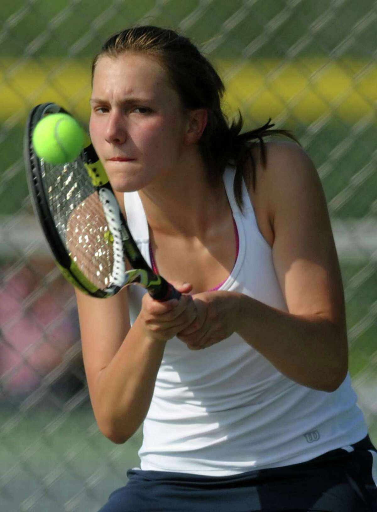Newtown's Lauren Beier returns a shot in the high school girls tennis match between Newtown and Joel Barlow at Newtown High School in Newtown, Conn. Wednesday, May 14, 2014.
