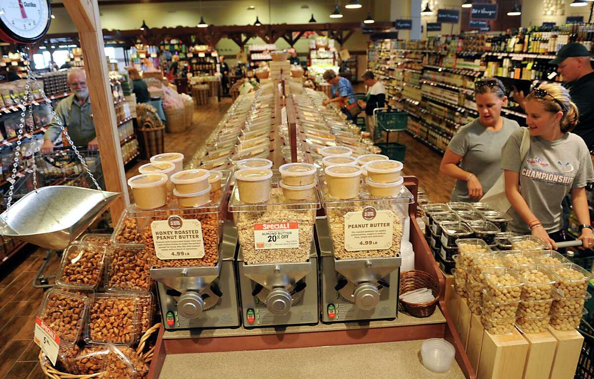 Customers shop in the bulk section of the new Saratoga Springs Fresh Market grocery store Wednesday, May 14, 2014, on Marion Ave. in Saratoga Springs, N.Y. This is the second Fresh Market store in the Capital Region. (Lori Van Buren / Times Union)