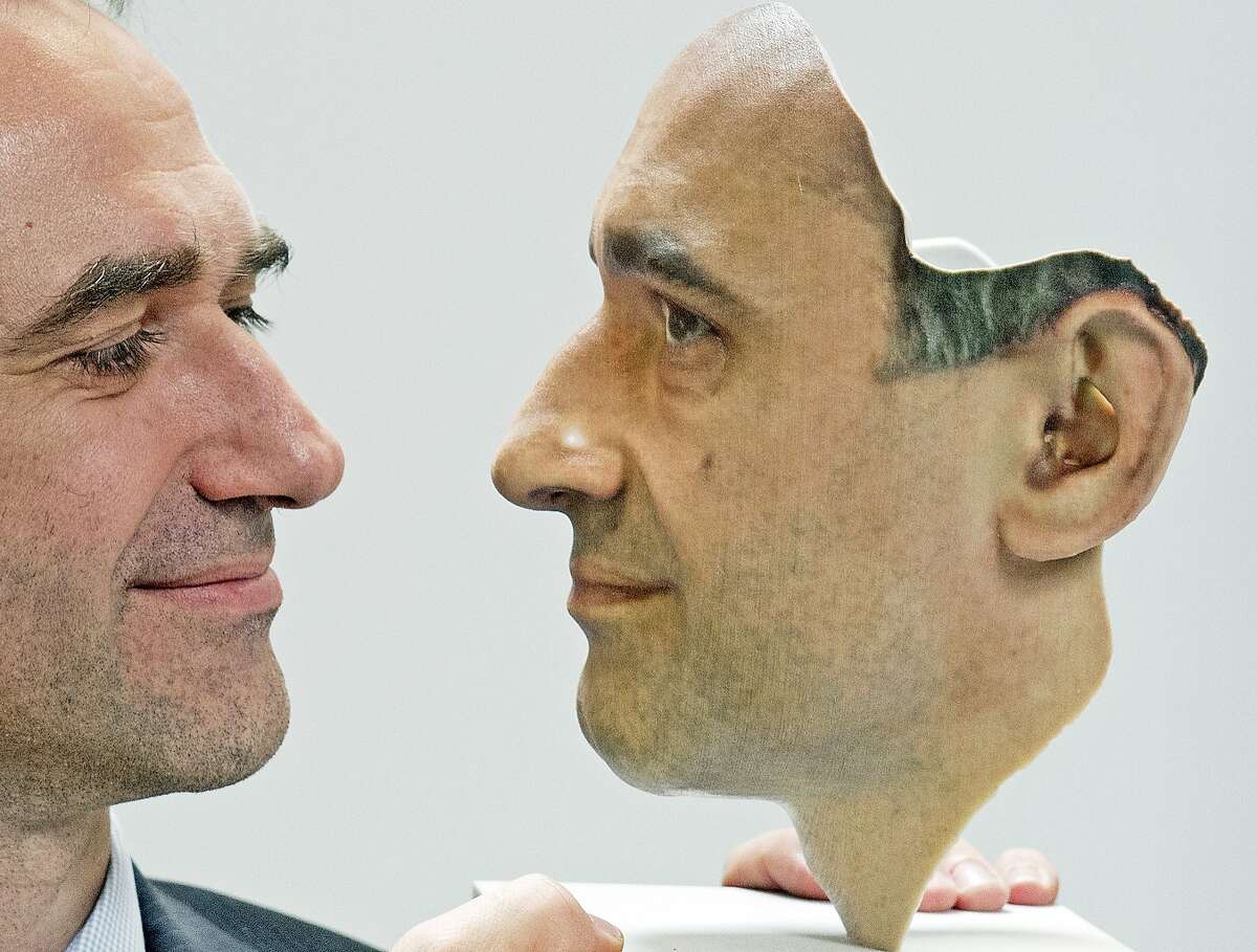 Technology finally matches the realism of 'Mission Impossible' masks: Mario Huettenhofer, chief of the German company 3D Fab, presents a 3D print of his own face at the FabCon 3.D and Rapid.Tech fair in Erfurt, Germany.