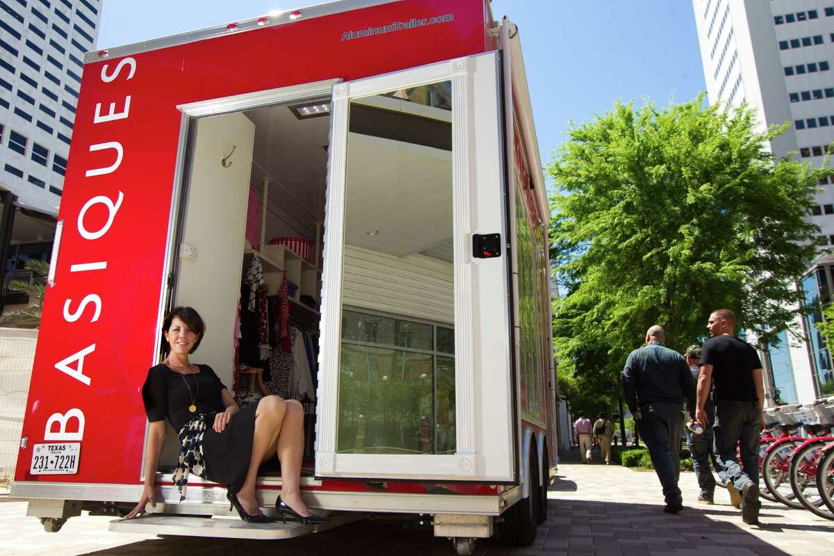 Sheri Falk's mobile fashion boutique, Basiques, has a camera that offers scans to let shoppers put their measurements on file for future purchases.