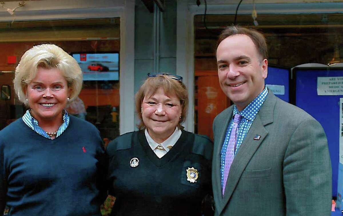 GEMS board member Ann Richardson Hagmann, GEMS CEO and Executive Director Charlee Tufts and First Selectman Peter Tesei attend the full-day benefit for the townís emergency medical service at the Cos Cobber restaurant Thursday.