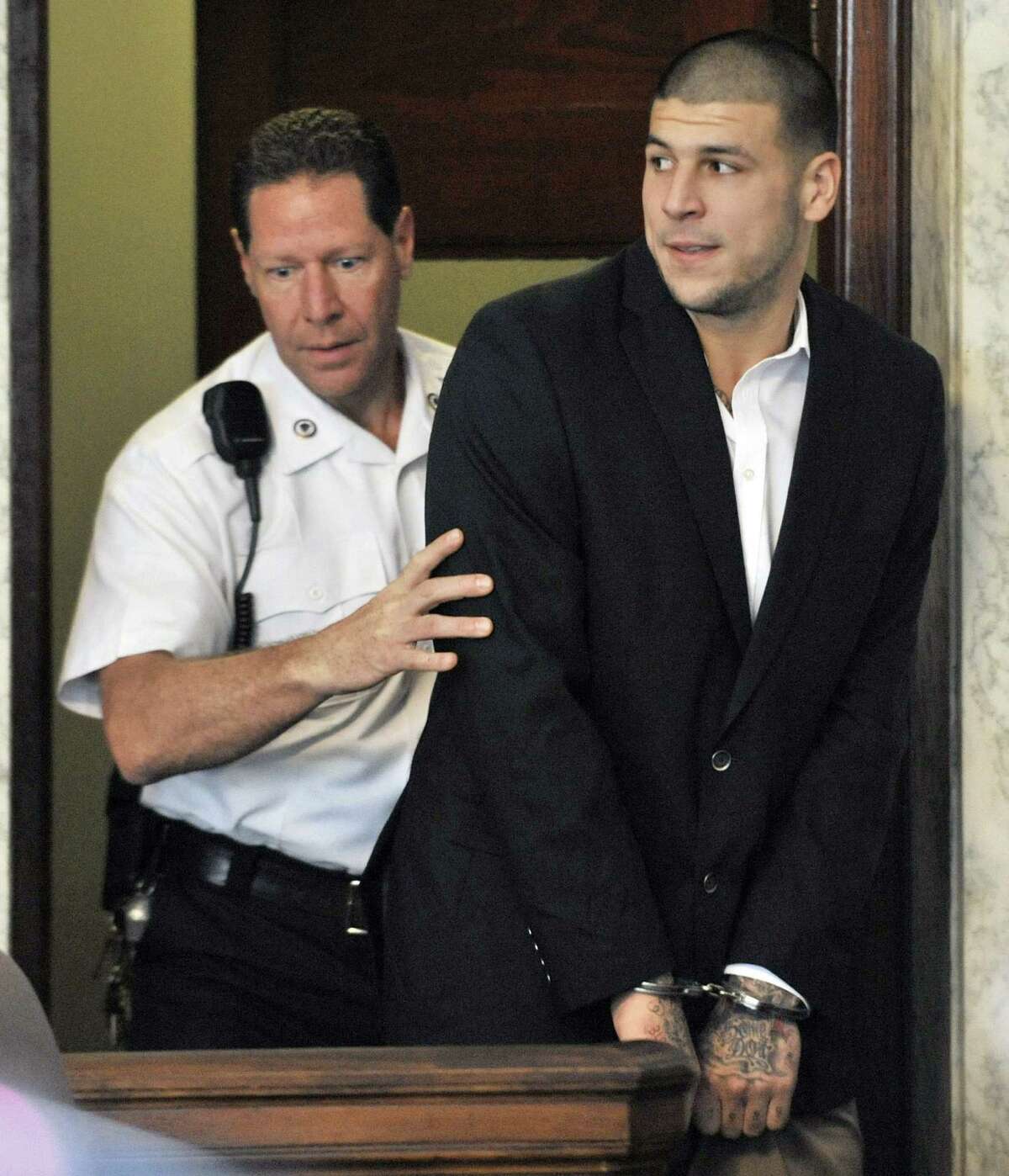 Hernandez charged in 2 more shooting deaths