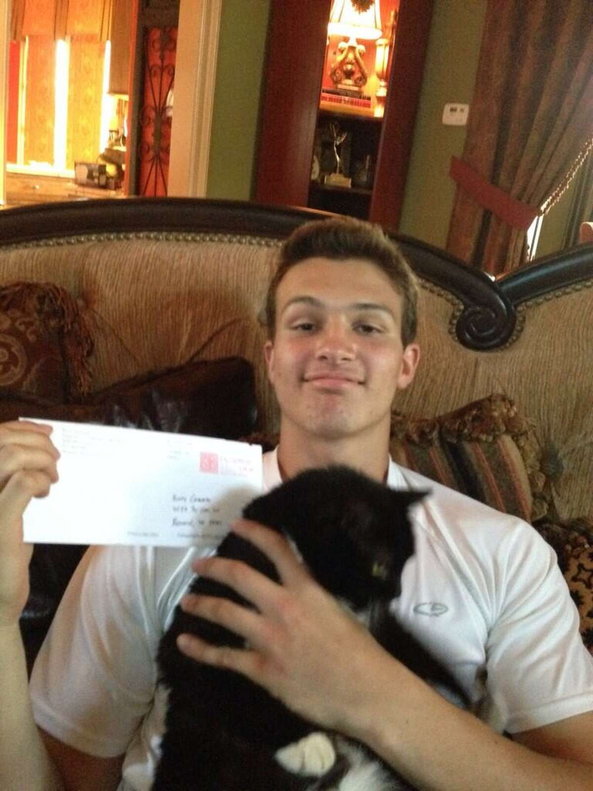 J.T. Granato with his cat after commiting to Rice. (@johngranato)