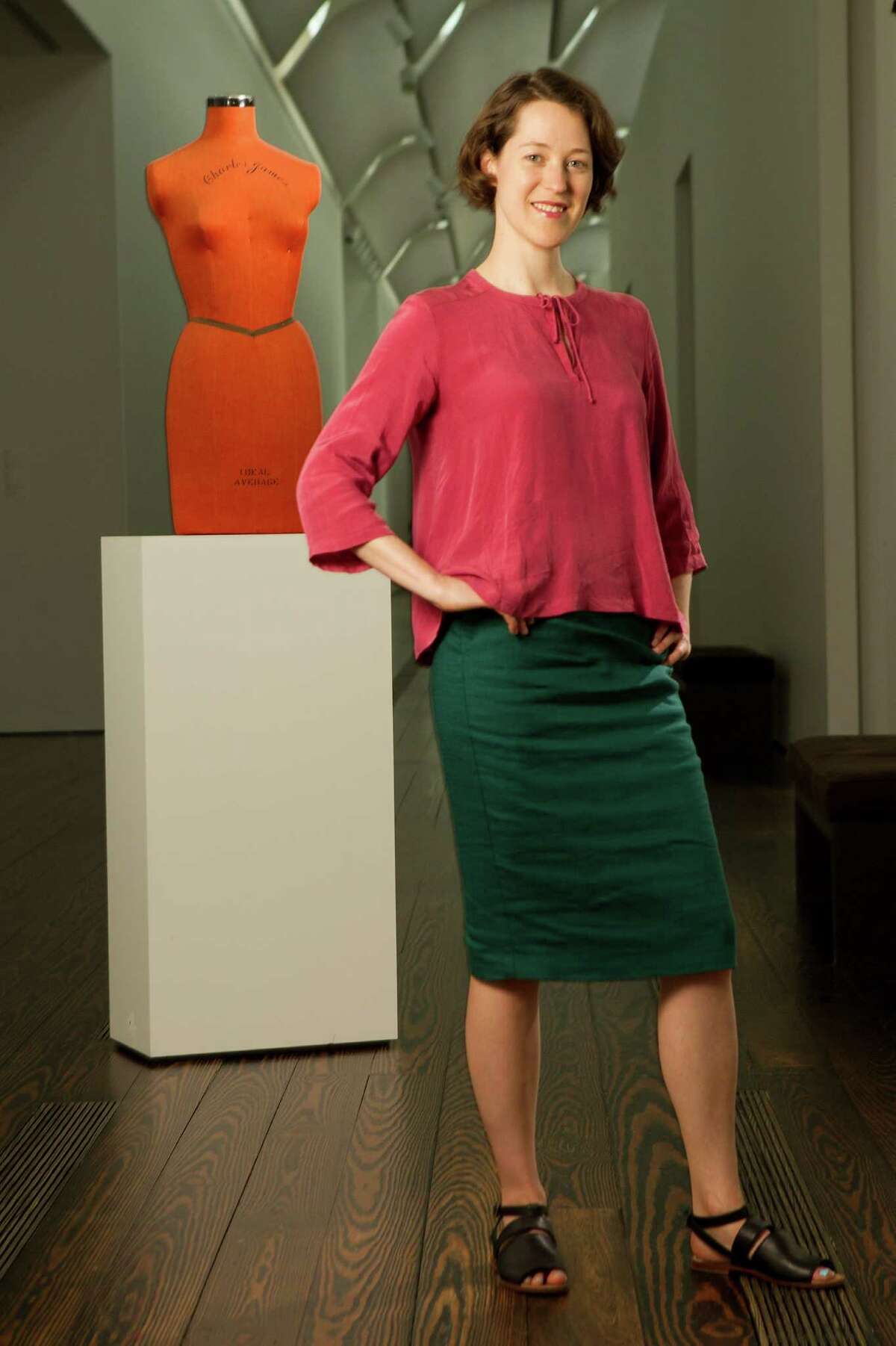Susan Sutton, curatorial assistant at the Menil Collection, poses for a portrait with a Charles James dress form on Monday, May 12, 2014, in Houston. Sutton has organized the exhibition "A Thin Wall of Air: Charles James." Sutton is wearing a top by Humanoid, a skirt by Samuji and sandals by Rachel Comey. ( Brett Coomer / Houston Chronicle )
